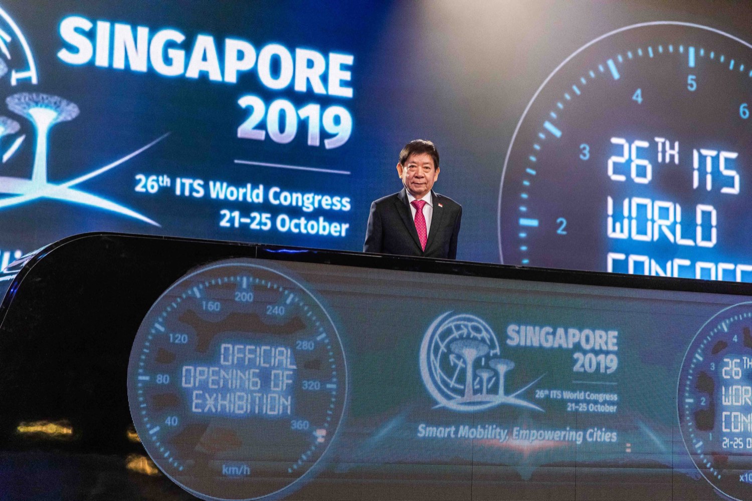 Speaker on stage at an international conference